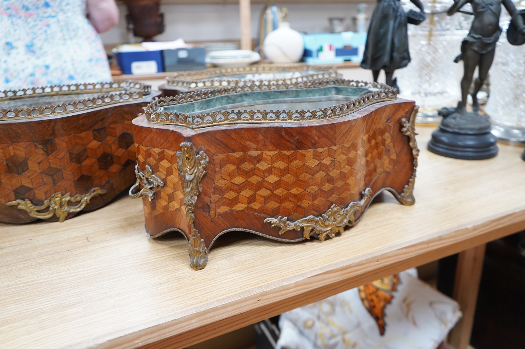 A pair of French Transitional style kingwood and parquetry table jardinières and one other, 43cm wide